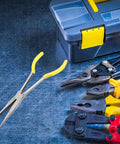 11 Inch Long Reach Needle Nose Pliers With Milled Jaws For Mechanics Technicians And Contractors next to toolbox on workbench