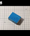Digital Particle Concentration Sensor PMS5003 for Air Quality Monitoring in metal casing, Arduino compatible, top view on grid surface.