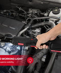 Using Three Eighths Inch Cordless Electric Ratchet Wrench Set With Beast Torque At 55 Ft-Lbs on an engine, highlighting LED light