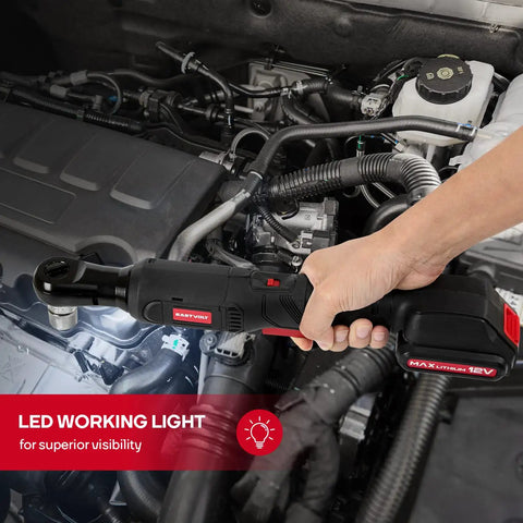 Using Three Eighths Inch Cordless Electric Ratchet Wrench Set With Beast Torque At 55 Ft-Lbs on an engine, highlighting LED light