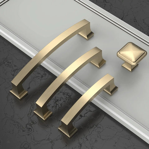 Brushed Brass Square Cabinet Knobs For Kitchen And Drawers Built Tough Cold Cast Metal Hardware with three handles and one knob.