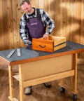 Man using Heavy Duty Rubber Workbench Mat 2x5 Feet for woodworking on tool bench with durable SBR and EPDM construction, grippy surface.