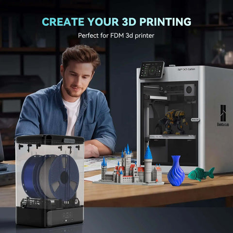3Kg Filament Dryer SP2 with Storage Box for 1.75mm and 2.85mm Filaments next to 3D printer and printed models on desk