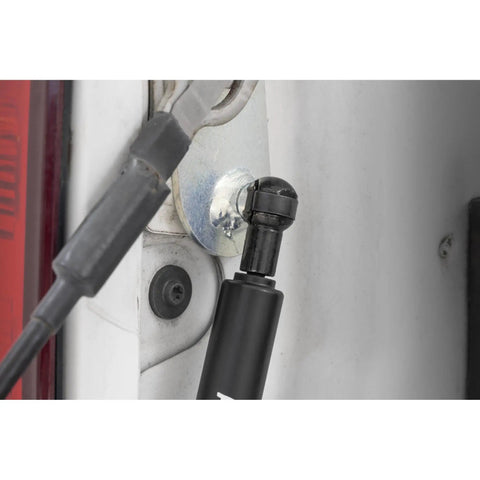 Close-up of Tailgate Assist for Ram 1500 2500 3500 Trucks 2010-2026 and Classic Models installed on truck bed corner.