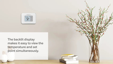 Non Programmable Thermostat With Backlit Display And No Fuss Simple Manual Controls on wall, white finish, home setting.