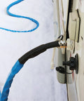 RVMATE heated RV water hose connected to RV inlet; blue insulated hose with brass connector