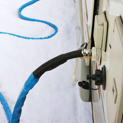 RVMATE heated RV water hose connected to RV inlet; blue insulated hose with brass connector