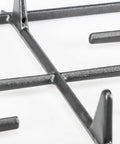 Close-up of WP9761557CB Replacement Surface Burner Grate For Whirlpool And KitchenAid Ranges; durable black finish.
