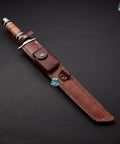 Hand Forged Short Sword With Sharp Tanto Blade, displayed in a brown leather sheath.