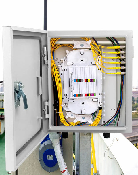 Beefy Heavy Duty Outdoor Electrical Box With Lock And Keys Rugged Fiberglass Reinforced Polyester And Steel Construction 12x10x6 Inch Weatherproof Junction Box For Industrial Mall And Residential Use, viewed with open door showing internal wiring.