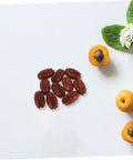 Realistic Walnut Miniature Pecans Set Ten Pieces For DIY Decor And Fake Food Props with yellow berries on white backdrop