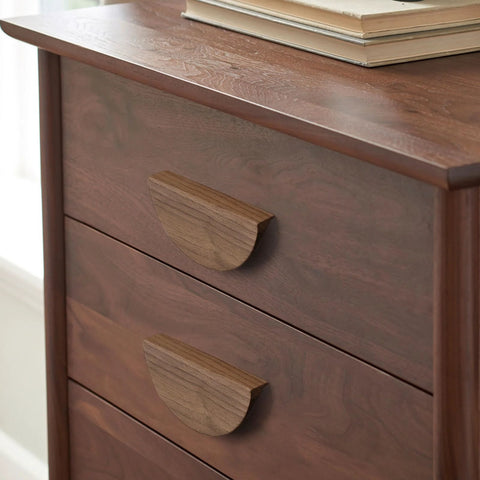 Walnut Wood Circular Cabinet Drawer Pulls Four Pairs Round Wood Grain Handles With Approximately Five Inch Length on a dresser