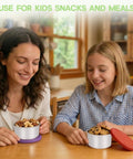 Two people using Six Pack 8oz Stainless Steel Snack Containers For Kids With Silicone Lids filled with snacks at a table.