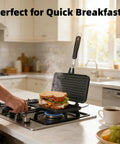 Flip Panini Sandwich Maker With Nonstick Aluminum Grill Pan And Handle used on stovetop, making a breakfast sandwich in kitchen.