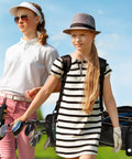 Two golfers carrying bags with golf clubs and using Golf Ball Holder And Tee Pouch Belt Clip Set 4 Pack Compact Ball Carrier.