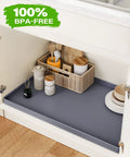 Waterproof Under Sink Mat 34x22 Inches Flexible Silicone Drip Tray for Kitchen and Bathroom Cabinets with BPA-Free label in cabinet.