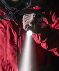 Person using LED Tactical Flashlight PTAC1000 Two Pack With One Mode Operation, High Lumen Output, Zoomable Beam, Water Resistant