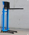 Heavy Duty Electric Pallet Stacker Hydraulic Lift 1100 Lbs Capacity Adjustable Forks Portable Industrial Warehouse Forklift Tool Cart side view on concrete floor.