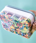 Slick 3 Tier Stackable Brick Storage Organizer With Removable Grid Trays For Lego Pieces, transparent crate filled with colorful LEGO bricks.