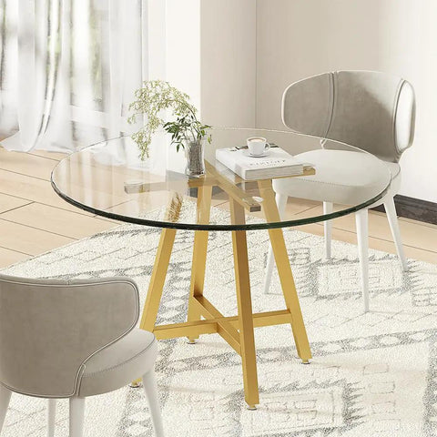 Gold X Shape Table Base For Glass Wood Marble Tops in dining setting with chairs