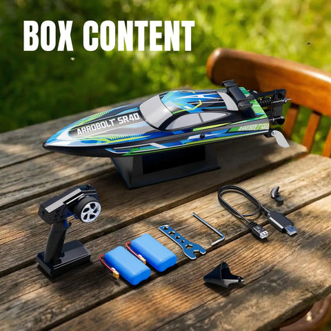 High Speed Brushless RC Boat For Adults With Dual Rechargeable Batteries 30 Minutes Run Time Proportional Throttle And Steering For Lakes 30 MPH Remote Control Boat Ready To Rip Through Waves box content including remote, batteries, charger, and accessories on a table outdoors