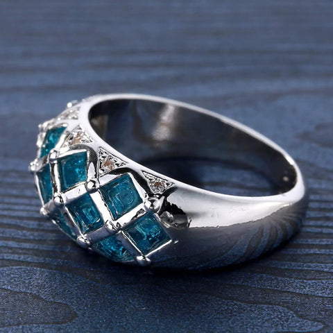 Womens Silver Plated Promise Ring With Blue Asscher Cubic Zirconia Grid Pave Design Size 10 Comfort Fit Solid Copper Band, angled view.