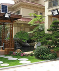 Solid Solar Flood Light With A Kickin Brightness Setup And Zero Sweat Weather Proofing For Your Patio Decks And Yard Upgrades Including Remote Controls And Hella Efficient Led Lighting illuminating a landscaped yard with a gazebo.