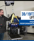 Strongway 1100 Lb Electric Cable Hoist with 2200 Lb Double Line Capacity in garage lifting a unit with 38ft height.