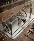 Sumsoctober Belt Grinder Jig Is The Ultimate Portable Manual Sharpener Featuring A V Shape Precision V Clamp Design For Sanding Belts On Knives Chisels And Metal Tools With Durable 304 Stainless Steel Construction As A Compact Handheld Fixed Angle Sander on a workbench.