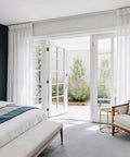 Whisper Quiet Ceiling Curtain Track With Wall Mount 9 To 12 Feet White No-Fuss Noise-Free Glide System With Heavy-Duty Rollers For Ultra Smooth Drapes And Quick Easy Installation installed above white bedroom French doors
