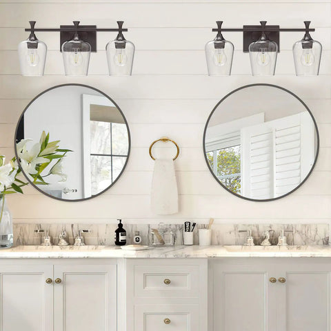 Bathroom with 3 Light Bathroom Vanity Light Fixture With Metal Modern Frame, Industrial Over Mirror Lighting, Farmhouse Wall Sconce With Clear Glass Shades, Durable Oil Rubbed Bronze Finish For A Fresh Bathroom Vibe above dual sinks