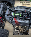 50T hardened steel spur gear with 20T pinion gear installed in RC car drivetrain; green motor visible inside chassis.