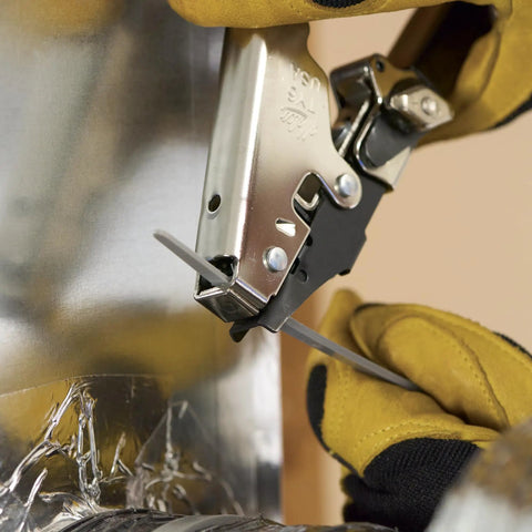 Close-up of HVAC Flex Duct Cable Tie Tensioning Tool With Auto Cut Off used on duct, showing adjustable tension knob in action