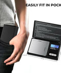 Dope Portable Digital Pocket Scale 0.01g Precision, 1000g Max, shown fitting in a pocket and open with backlit LCD display.