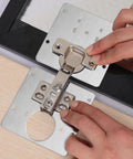 Heavy Duty Stainless Steel Cabinet Hinge Repair Plate Kit With Five Pre Drilled Holes And Matching Screws No Sweat Quick Fix being installed.