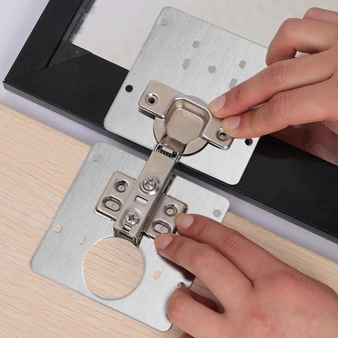 Heavy Duty Stainless Steel Cabinet Hinge Repair Plate Kit With Five Pre Drilled Holes And Matching Screws No Sweat Quick Fix being installed.