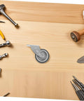 Sagging Sliding Door Guide Roller Wheel For Barn Doors on wooden surface surrounded by tools