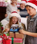 Two children in festive hats playing with Kid Friendly Entry Level Coding Robot Kit For Kids Aged 8 To 12 Learn Scratch And Arduino