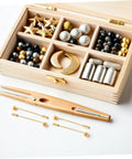 Bulk 50 Pack Copper Flat Round Tray Lapel Pins With Heavy Fabric Fastening And Raw Finish Metal Brooch Sticks For Industrial Crafts And Costume Accessories, various decorative elements in a wooden box.