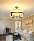 Four Light Modern Drum Chandelier With Fabric Shade, Semi Flush Mount Ceiling Light In Matte Black Iron in living room.