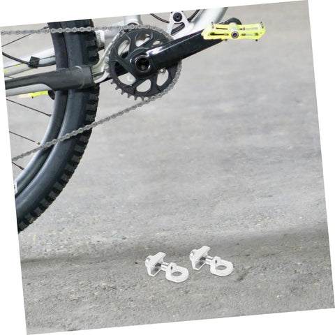 Adjustable Aluminum Alloy Bike Chain Tensioner Tool 2 Piece Set For Folding Bikes displayed near bike crank and chain.