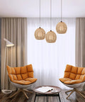 Living room with Vintage Rattan Pendant Light Shade Set For Home Cafe And Teahouse Decor over orange chairs, cozy rustic vibes.
