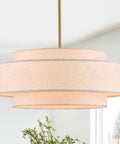 Totally Iconic 24 Inch Linen Drum Chandelier With Six Warm Lights Featuring Sleek Gold Frame And Three Tier Vintage Farmhouse Design.