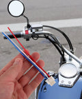 Universal Motorcycle Wiring Harness Connector Kit With Horn Headlight Turn Signal Heavy Duty Relay in hand on bike