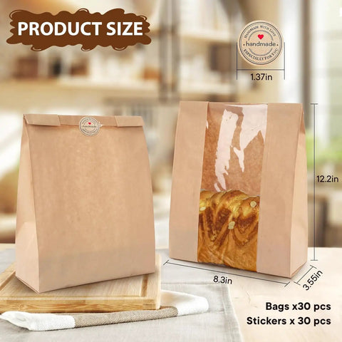 30 Pack Bread Bags With Window Including 30 Homemade Bread Storage Label Stickers Clear Window Bakery Bags For Fresh Baked Goods Large 13.7x8.3x3.5 Inches Great For Gifting And Storing image showing two kraft paper bags with clear windows displaying bread on a wooden table.
