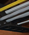 Box Of Fifty H2 Homer Helpers For Electrical Wire Management, black cable bracket holding multiple wires in place.