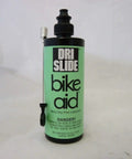 Dri-Slide Dry Moly Lube 4 Oz bottle with needle nozzle, labeled bike aid. Perfect for bike chains, cables, and moving parts.