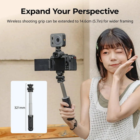Person using Multifunction Wireless Shooting Grip With Adjustable Selfie Stick And Integrated Remote with camera setup