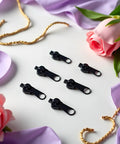 6 Piece Universal Instant Zipper Repair Kit With Replacement Sliders That Work With Most Standard Zippers For Clothing Bags And Accessories Easy Do It Yourself Fix No Tools Needed Durable Black displayed on floral background