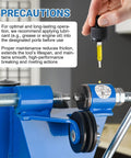 2 In 1 Chainsaw Chain Breaker And Spinner Tool Kit with lubrication instructions on a blue cast iron tool in workshop.
